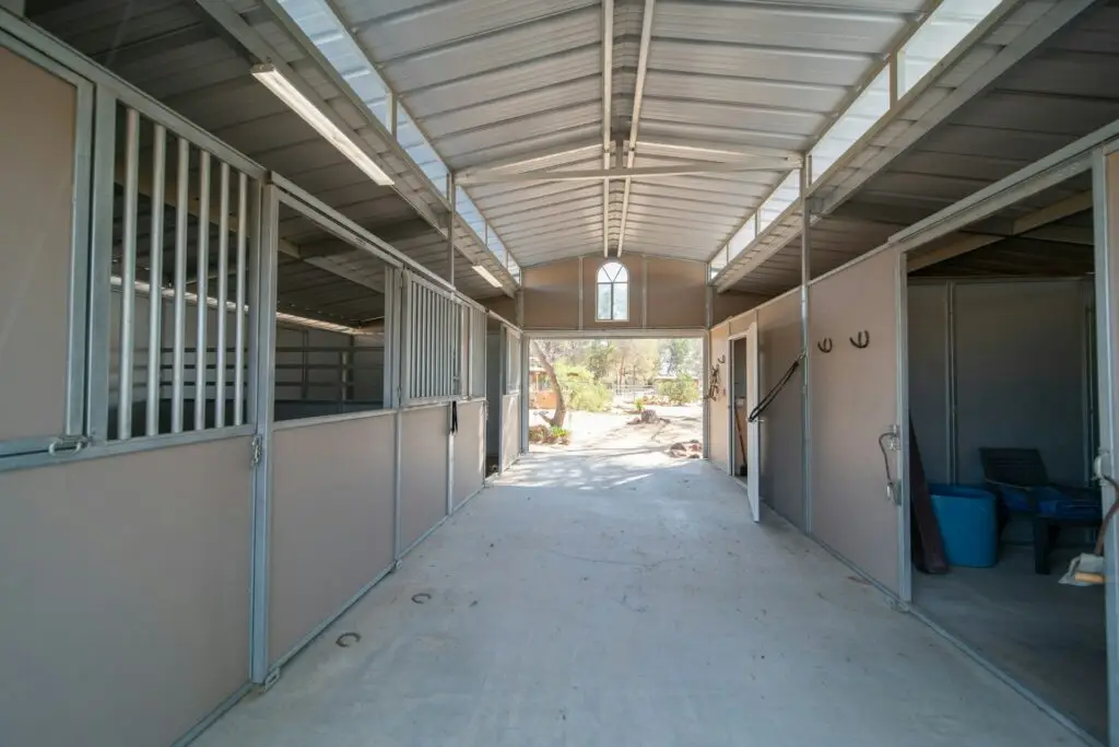 Clean horse stable aisle providing shelter and space for fall and winter care